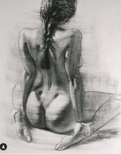 Charcoal sketch of a seated woman with a braid, viewed from behind, capturing graceful lines and artistry.