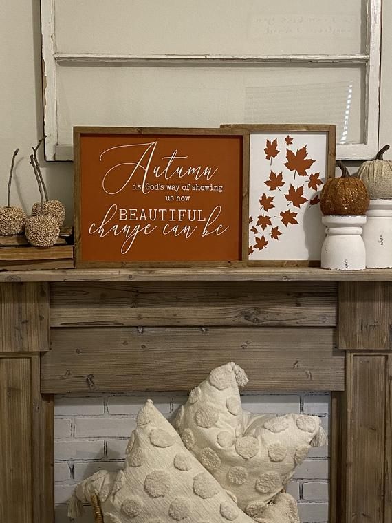 Cozy autumn decor with leaf art and a sign saying, Autumn is God's way of showing us how beautiful change can be.