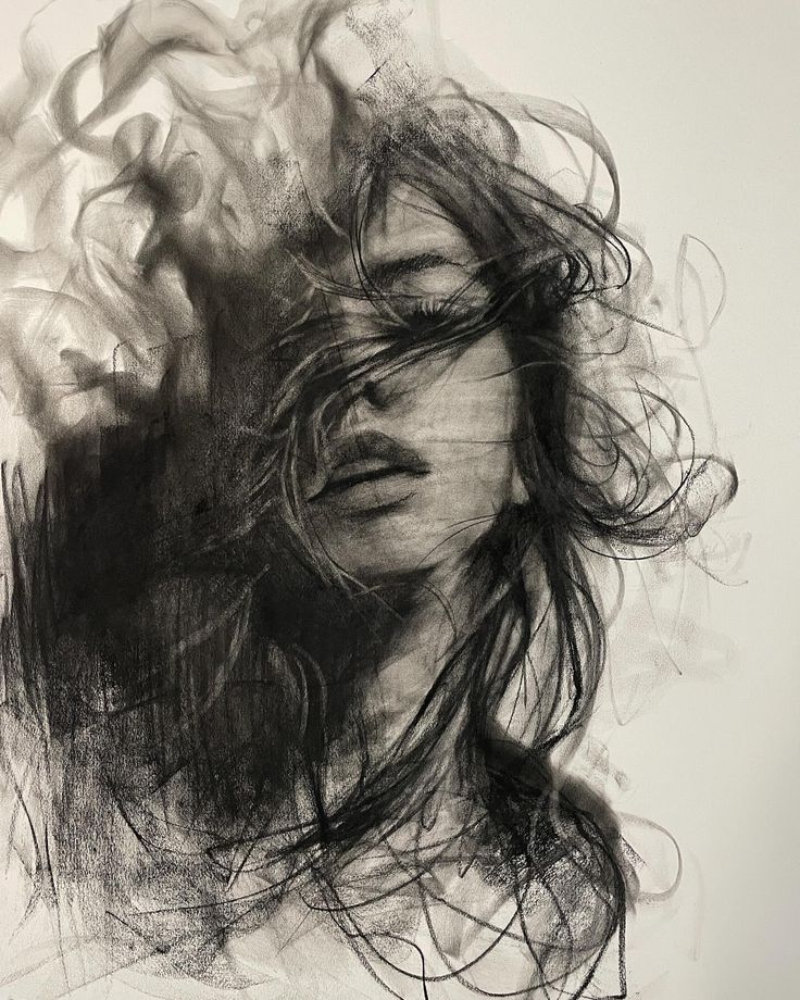 Charcoal sketch of a woman with flowing hair, evoking mystery and emotion.