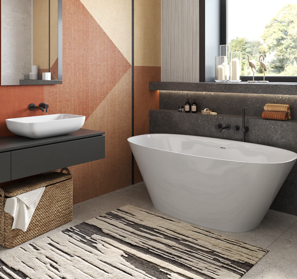 Modern bathroom with freestanding bathtub, stylish sink, and geometric decor.