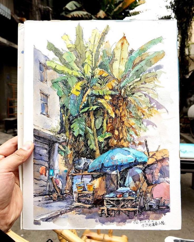 Colorful watercolor of a tropical street scene with large banana trees and a blue umbrella in the foreground.