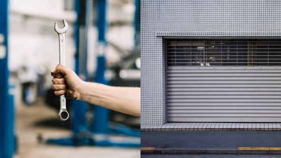 Hand holding wrench in garage setting next to closed industrial shutter, symbolizing repair and maintenance.