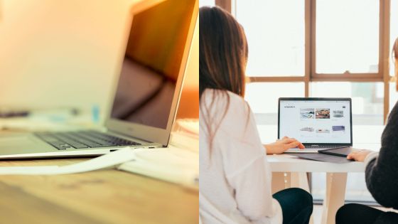 Two people collaborating on laptop work at a bright office desk, showcasing teamwork and productivity.