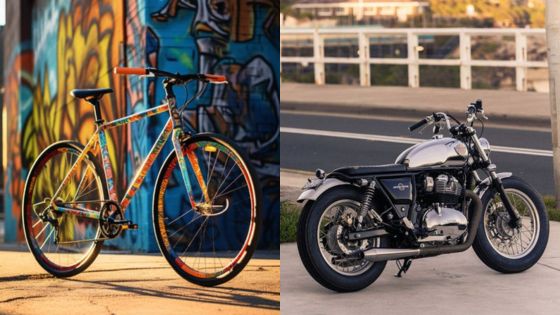 Colorful bicycle next to graffiti and classic motorcycle by a road, highlighting urban and vintage transportation styles.