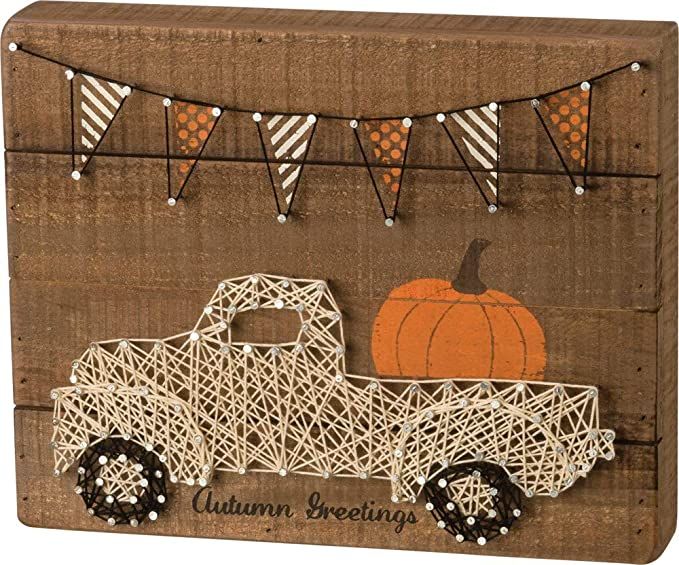 Rustic autumn decor with string art truck, pumpkin, and festive bunting. Perfect for seasonal greetings.