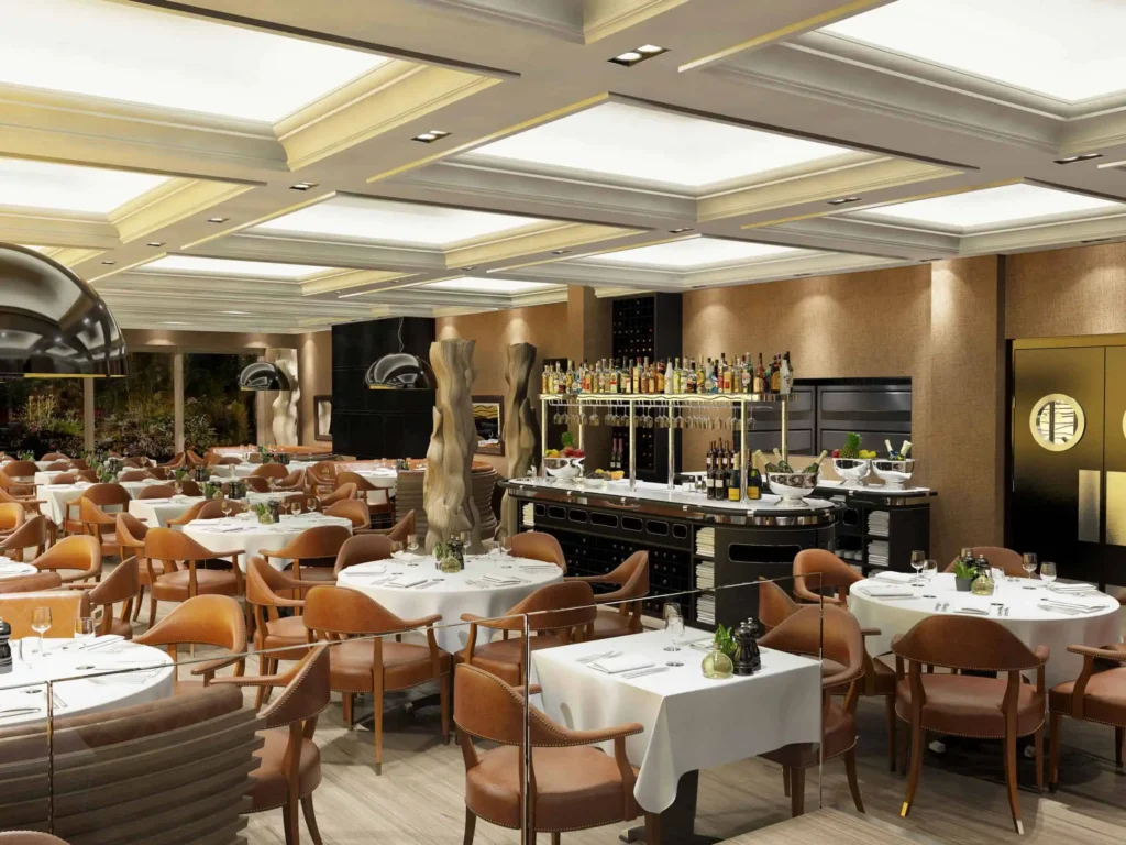 Elegant restaurant with modern decor, featuring a well-stocked bar and white tablecloth settings for fine dining.