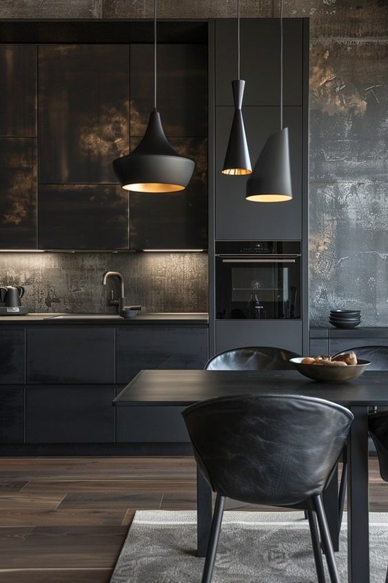 Modern kitchen with dark cabinets, pendant lights, and dining area. Sleek and contemporary design.