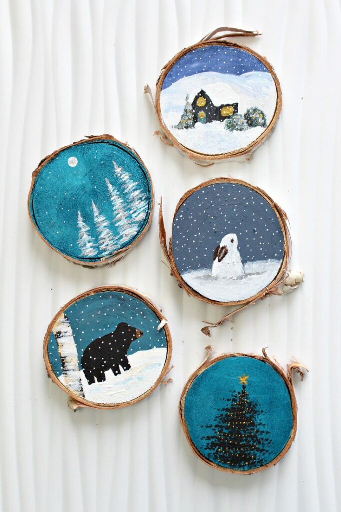 ивив Hand-painted winter scenes on wood slices: snowy trees, cabin, snowman, bear, and Christmas tree with star. | Sky Rye Design Hand-painted winter scenes on wood slices: snowy trees, cabin, snowman, bear, and Christmas tree with star.