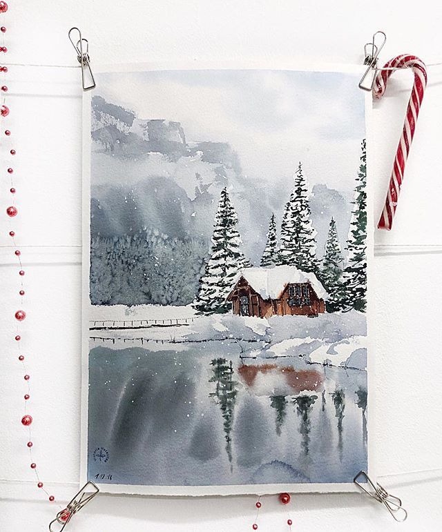 Watercolor painting of a snowy cabin by a lake, surrounded by pine trees, reflecting winter tranquility and serenity.