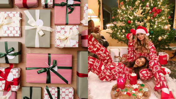 Festive Christmas scene with wrapped gifts and two people in matching pajamas, sitting by a decorated tree with candles.