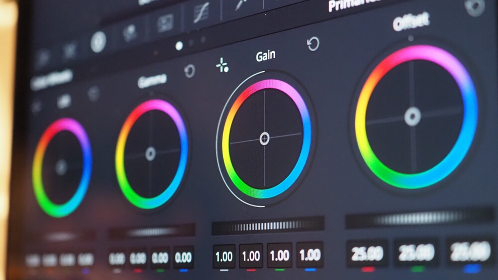 Color correction software interface showing vibrant color adjustment wheels for editing visuals.