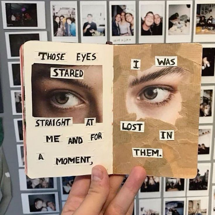 Open journal pages with collage and text about captivating eyes, surrounded by polaroid photos on the wall.