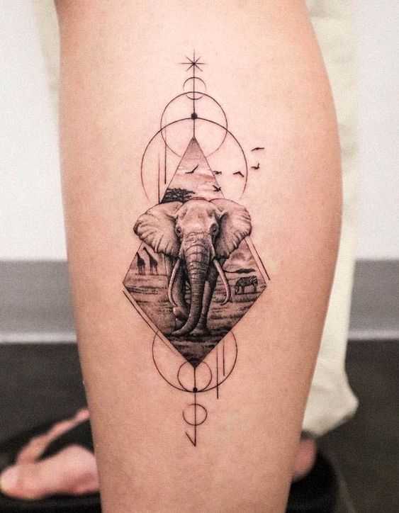 Geometric elephant tattoo with African landscape, birds, and intricate patterns on leg.