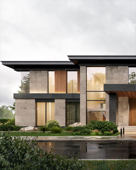 Modern two-story house with large windows and landscaped garden on a rainy day.