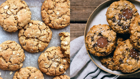 Freshly baked oatmeal cookies on a baking sheet and plate, showcasing delicious chocolate chips and oat texture.