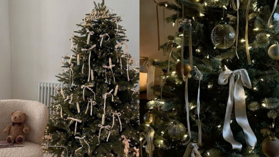 Christmas tree with elegant ribbons and lights next to a cozy chair and teddy bear.