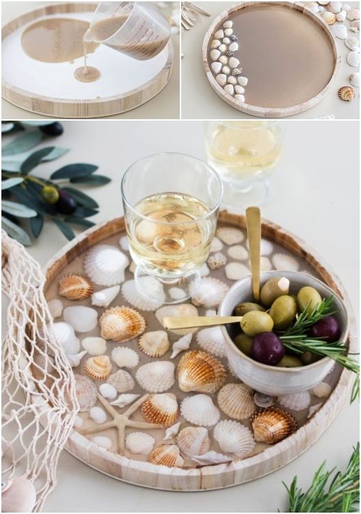 DIY resin tray with seashells, wine glass, and olives, perfect for beach-themed decor or serving elegant appetizers.