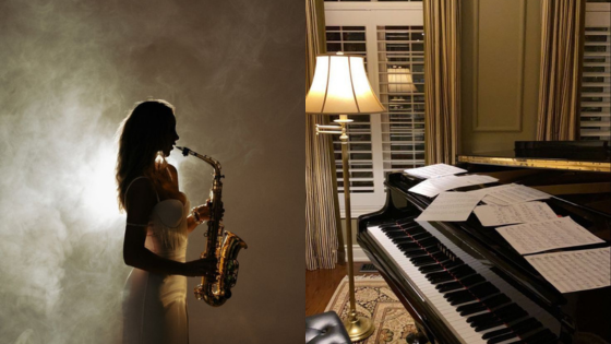 Silhouette of woman playing saxophone next to a piano with sheet music in a softly lit room.