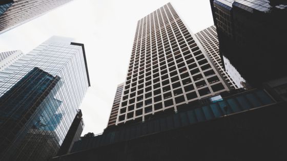 Urban skyscrapers reaching towards the sky, showcasing modern architecture and cityscape vibrancy.