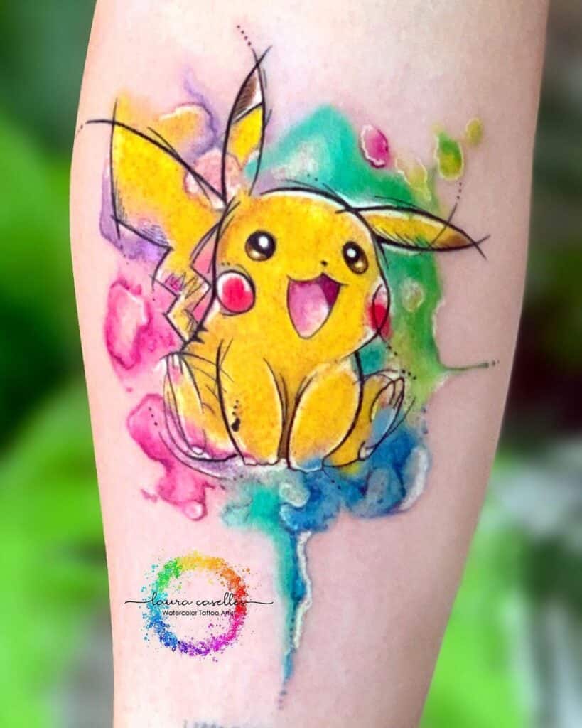Watercolor Anime Tattoos 1 Pikachu watercolor tattoo on forearm with vibrant yellow, pink, teal and blue splashes — cute sketch-style Pokemon tattoo art | Sky Rye Design Pikachu watercolor tattoo on forearm with vibrant yellow, pink, teal and blue splashes — cute sketch-style Pokemon tattoo art