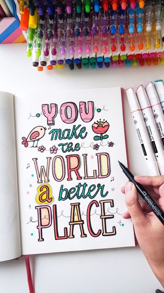 Colorful hand-lettered quote You make the world a better place with art markers and pens.