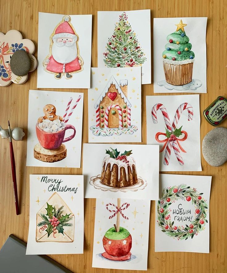 Festive Christmas watercolor illustrations, featuring Santa, tree, cupcake, candy canes, and greeting cards on display.