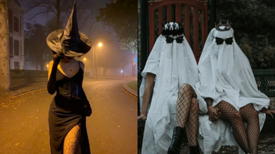 Witch and ghost costumes in a misty Halloween setting, two wearing nets, holding hands on a bench with a spooky vibe.