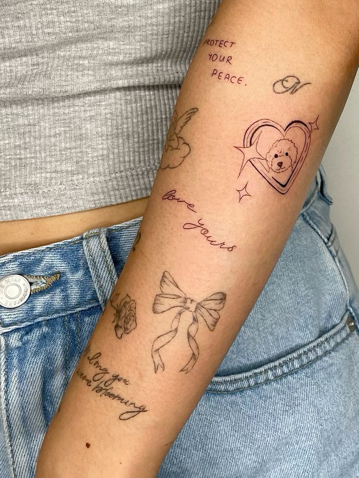 Person's arm with multiple minimalist tattoos, including phrases like protect your peace and love yours, a bow, and heart.