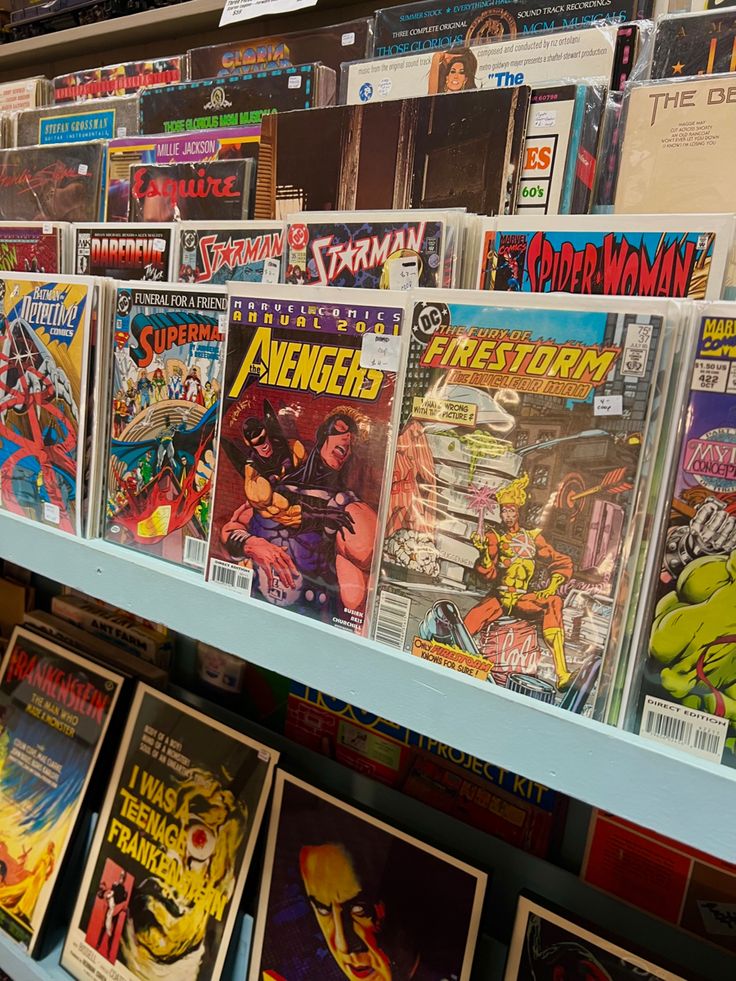 Comic book collection on display featuring various series, including Avengers and Superman, at a vintage shop.