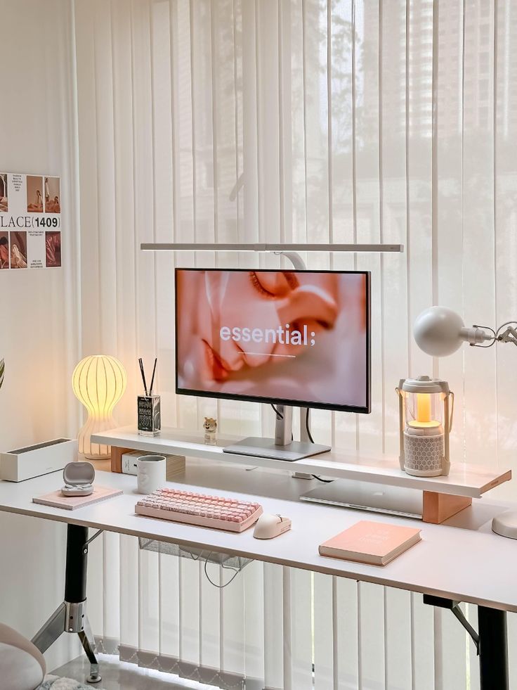 Minimalist home office desk setup with a monitor, keyboard, and soft lighting, enhancing productivity and aesthetics.