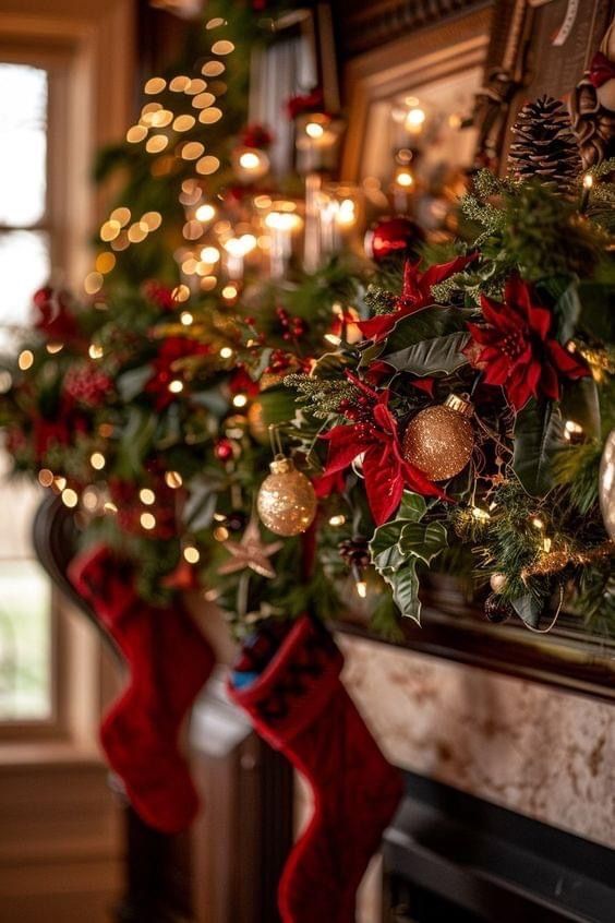 Festive holiday mantel with red stockings, poinsettias, and golden ornaments adorned with twinkling lights.