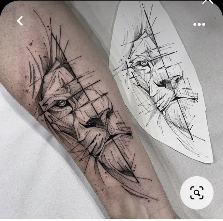 Abstract lion tattoo design on forearm with matching sketch on paper, showcasing geometric lines and shading.