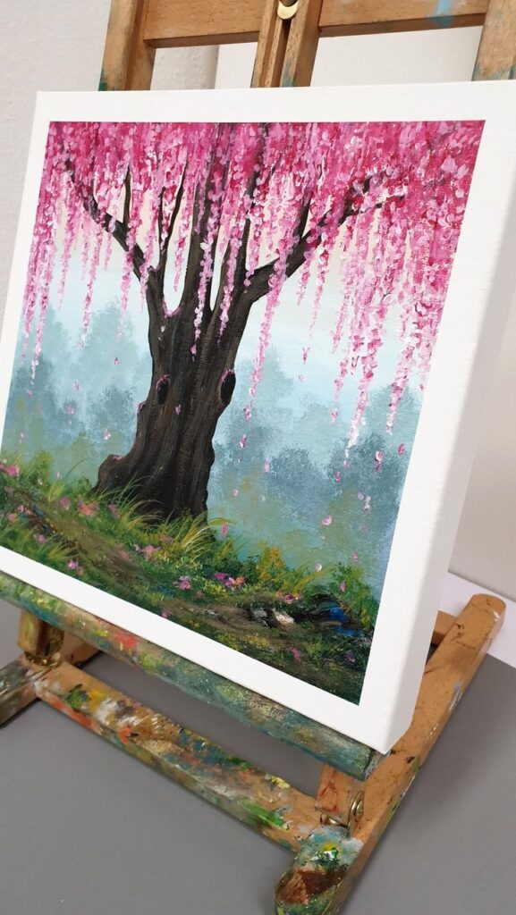 Cherry blossom painting Сherry plum tree art Сherry blossom art pink blush wall art plum tree cute bathroom wall decor Spa wow art Canvas painting of a tree with pink blossoms on an easel; serene and colorful nature artwork. | Sky Rye Design Canvas painting of a tree with pink blossoms on an easel; serene and colorful nature artwork.