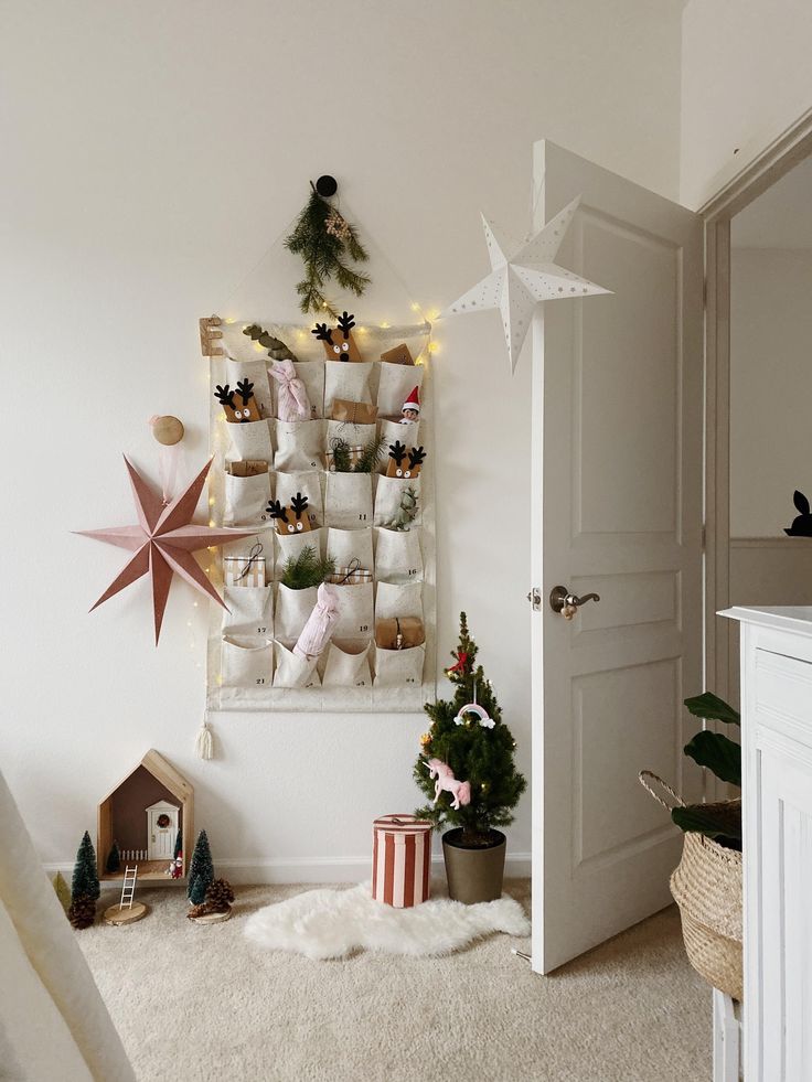 Festive Christmas room decor with star, advent calendar, mini tree, and toys, creating a cozy holiday atmosphere.