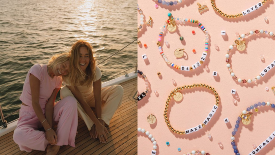 Two people relaxing on a boat at sunset next to colorful beaded bracelets with inspirational messages on a pink background.