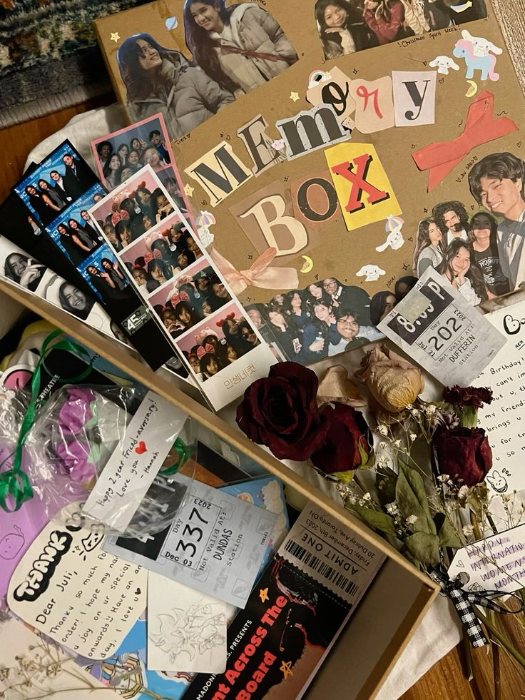 Memory box filled with photos, tickets, and dried flowers, capturing cherished moments and nostalgia.