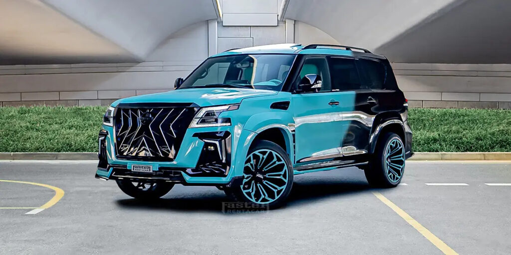 Sleek turquoise SUV with custom wheels in an urban setting, showcasing modern automotive design and luxury features.