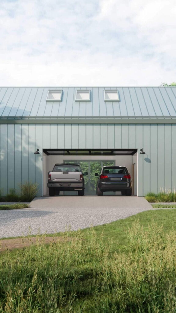 Modern metal garage with two cars inside, featuring sleek design and skylights under a clear blue sky.