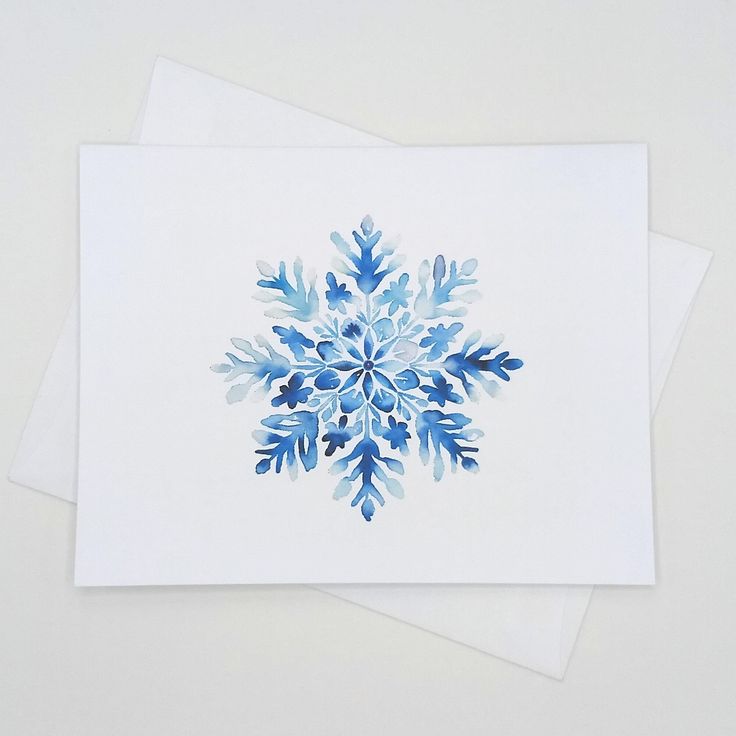 Watercolor snowflake greeting card on white background, showcasing intricate blue design. Perfect for winter occasions.