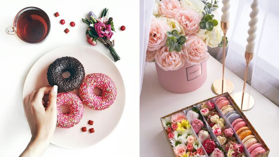 Plate of colorful donuts with tea, flowers, and macarons beautifully arranged for a dessert and floral display.