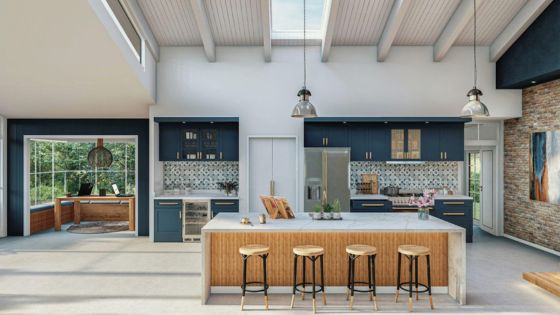 Modern kitchen with blue cabinets, island seating, skylight, and large windows offering a bright, open space ambiance.