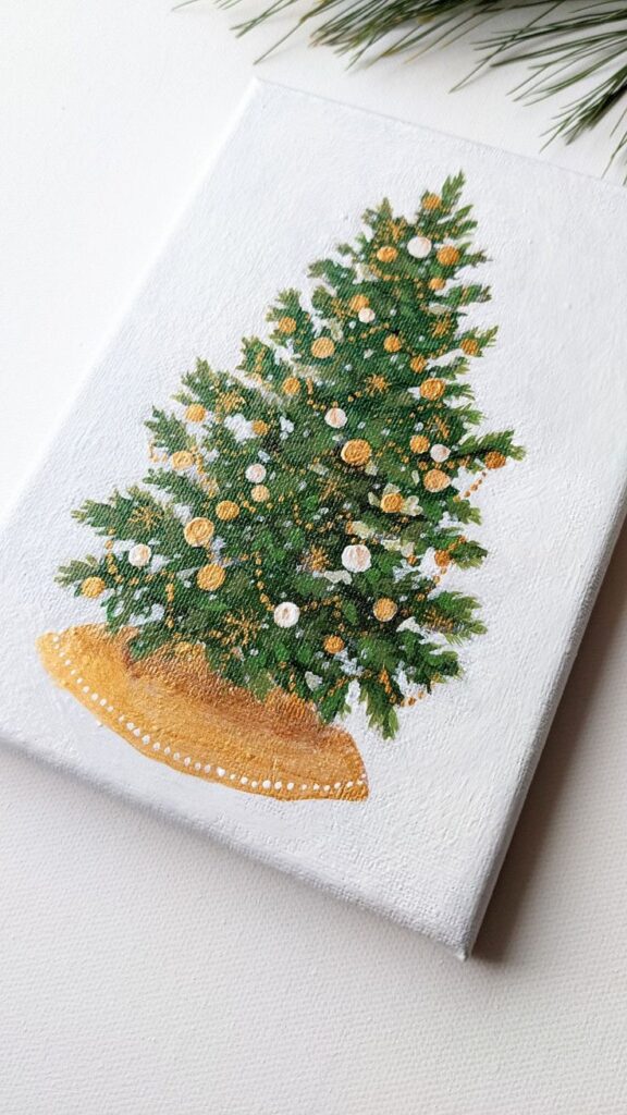 Hand-painted Christmas tree with ornaments on a white canvas, ideal festive decoration or holiday gift.