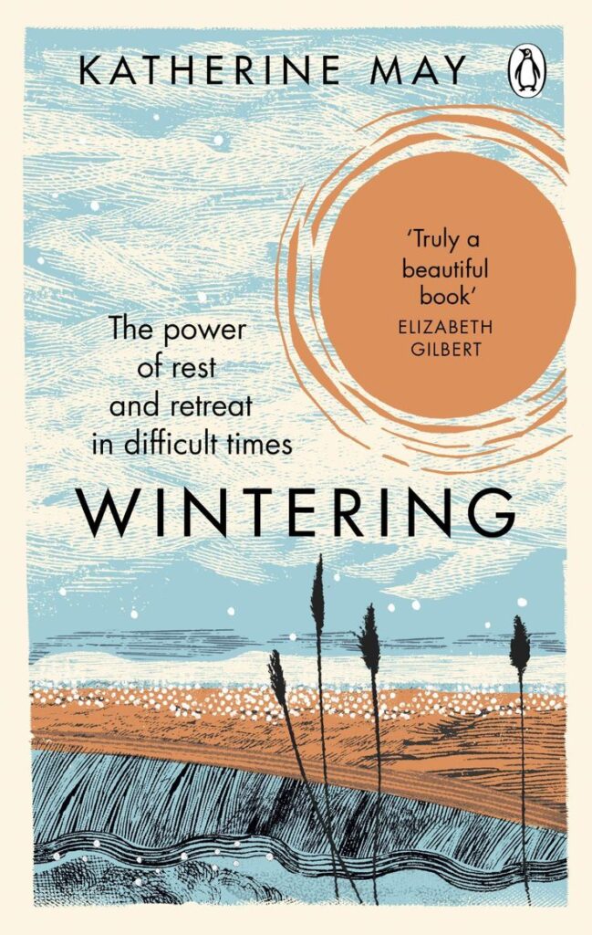 Cover of Wintering by Katherine May, with serene landscape illustration and a quote by Elizabeth Gilbert.