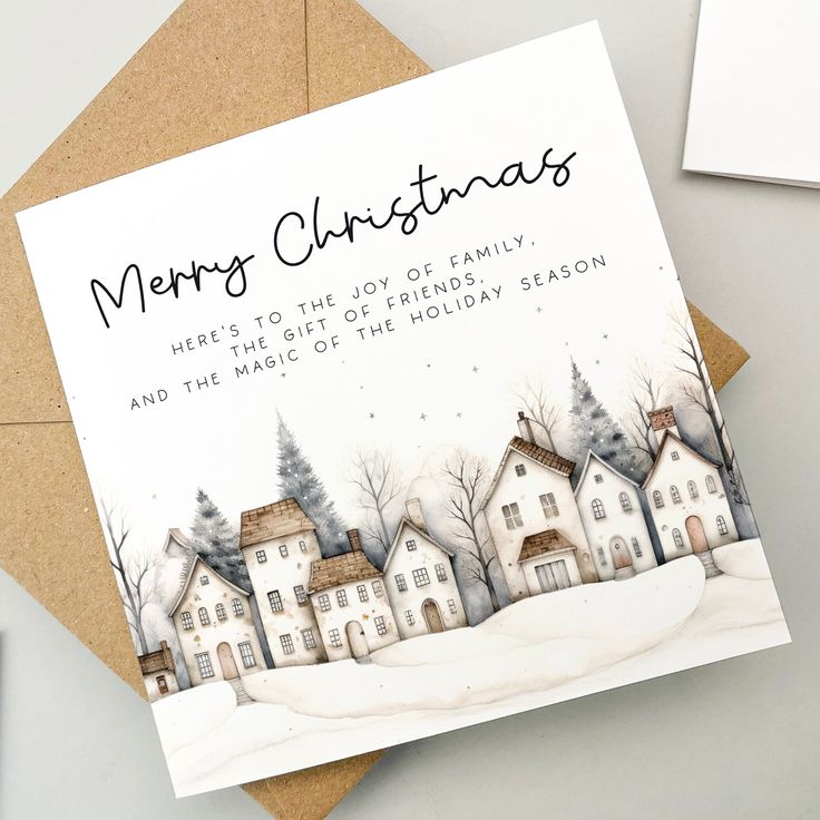 Christmas card with snowy village scene and message about family, friendship, and holiday magic.