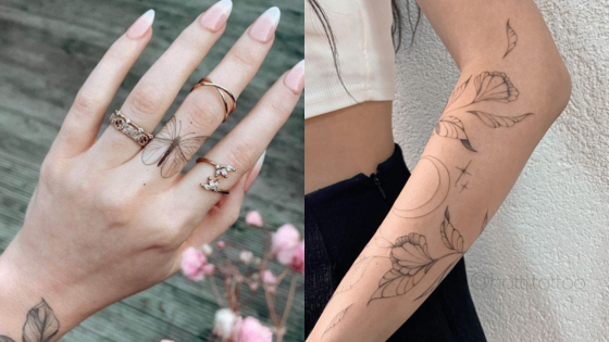 Minimalist butterfly and floral tattoos on hand and arm with stylish rings and crop top.