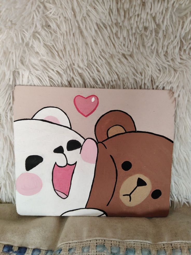 Cute cartoon bears hugging with a heart symbol, on a fluffy blanket background.