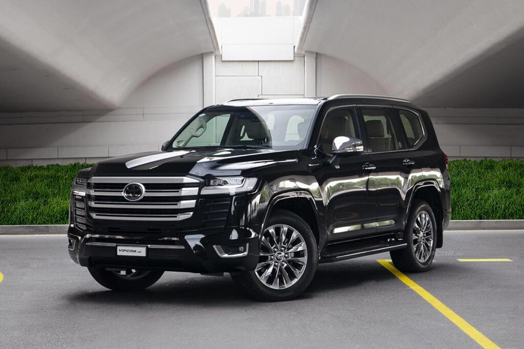 Black SUV parked under a modern bridge, showcasing sleek design and luxury features.