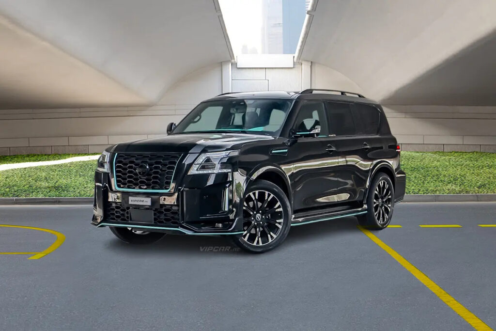 Sleek black SUV parked under a modern bridge, showcasing luxury and style.