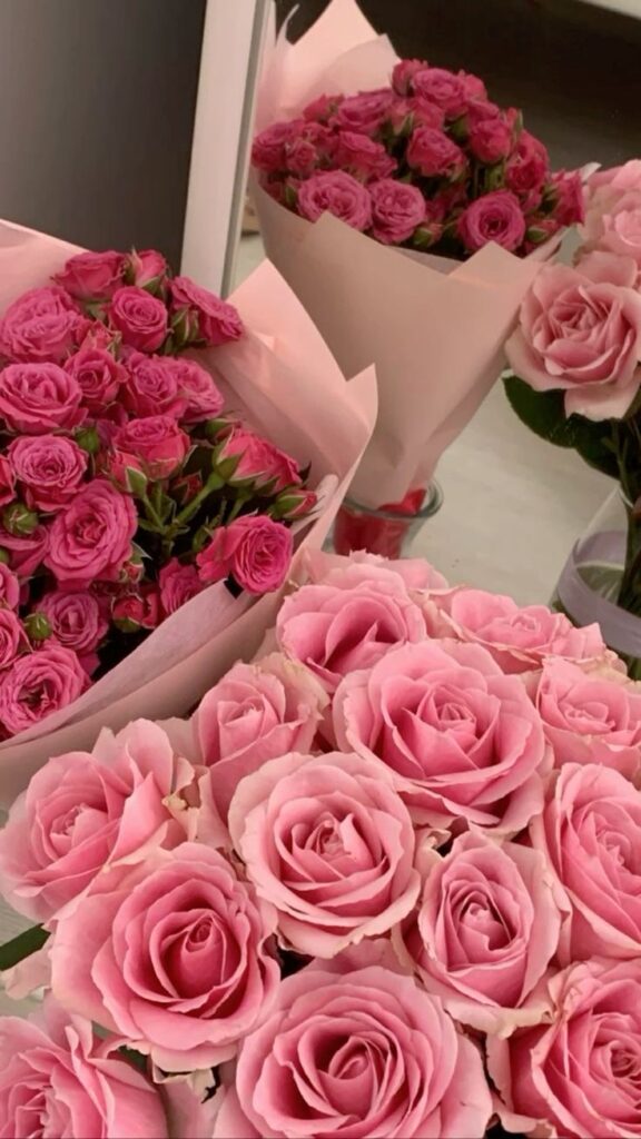 Bouquets of vibrant pink roses displayed elegantly, perfect for weddings, anniversaries, or romantic gifts.