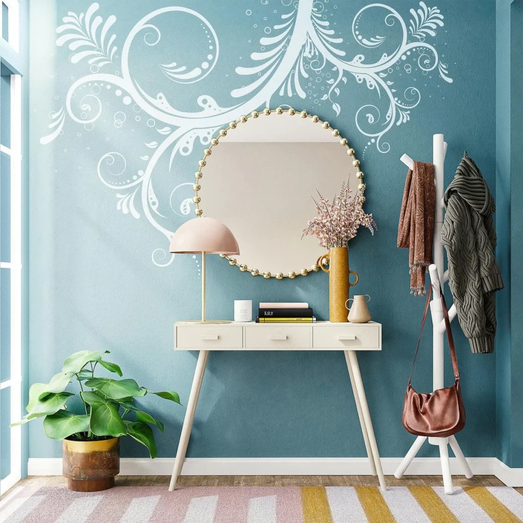 Stylish entryway with blue accent wall, round mirror, console table, coat rack, and plants. Cozy and inviting decor.